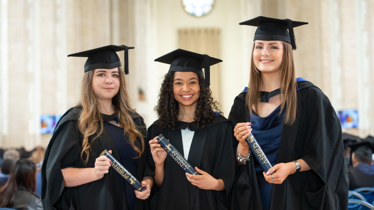 Three graduands in the Cathedral