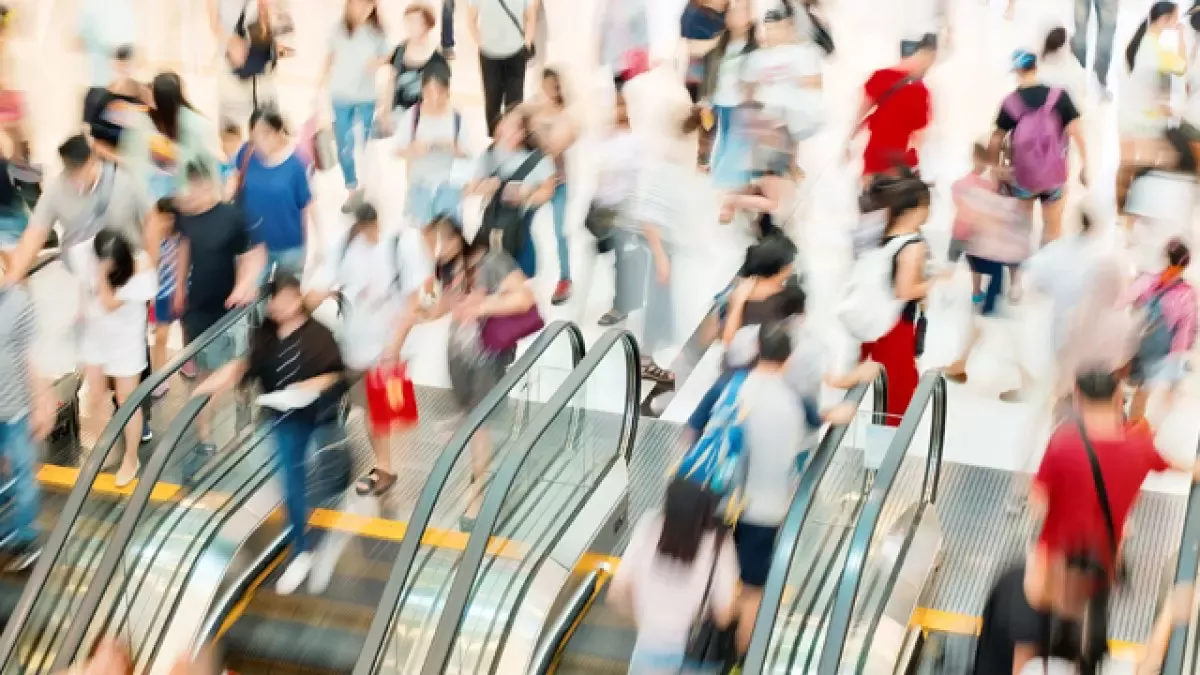 People travelling on escalators