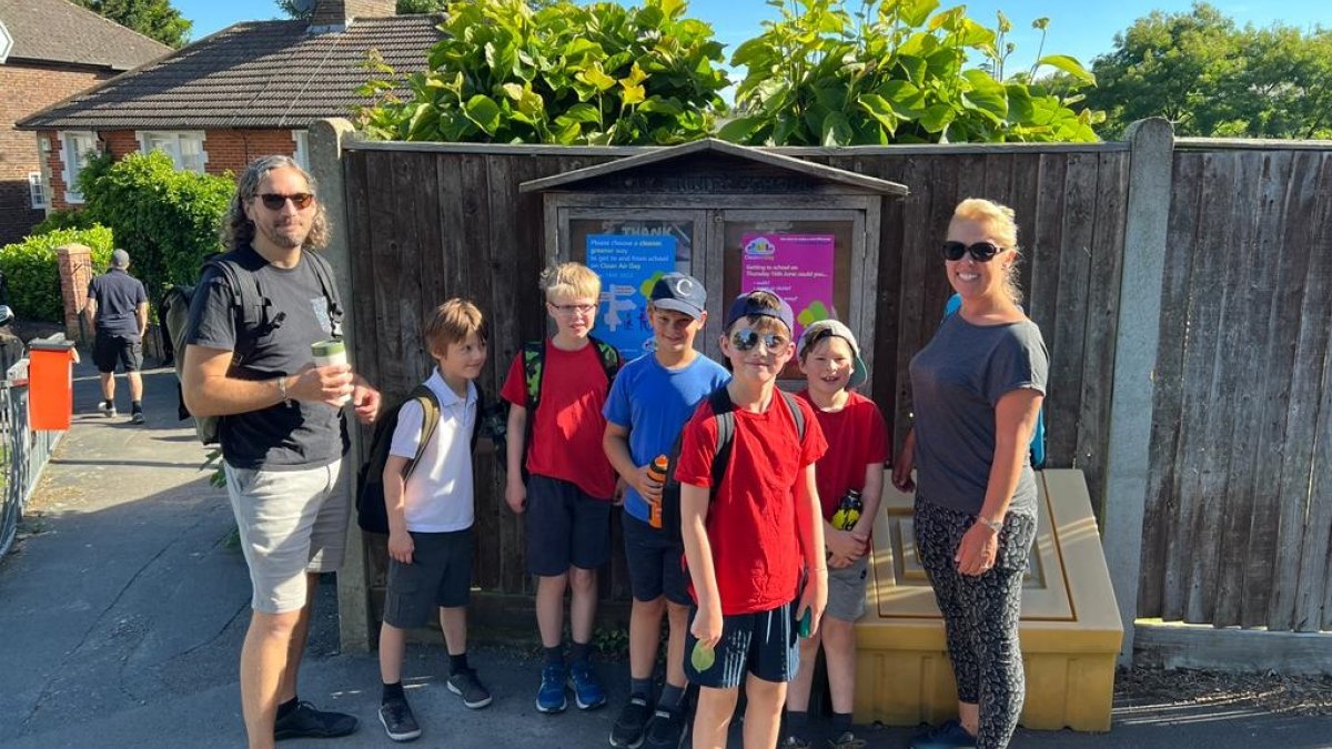 Children arrive at Holy Trinity School by walking bus