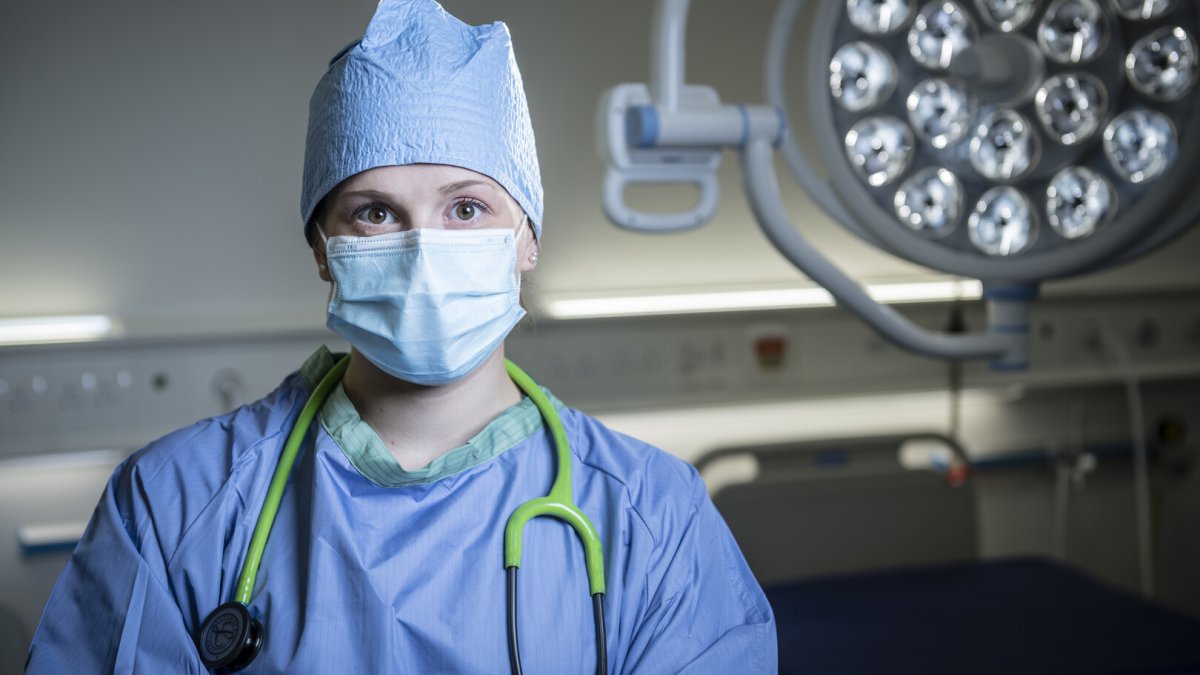 Medical School student in surgical gown