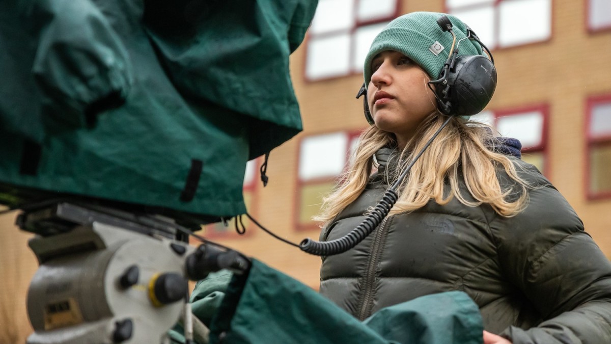 Student filming outdoors