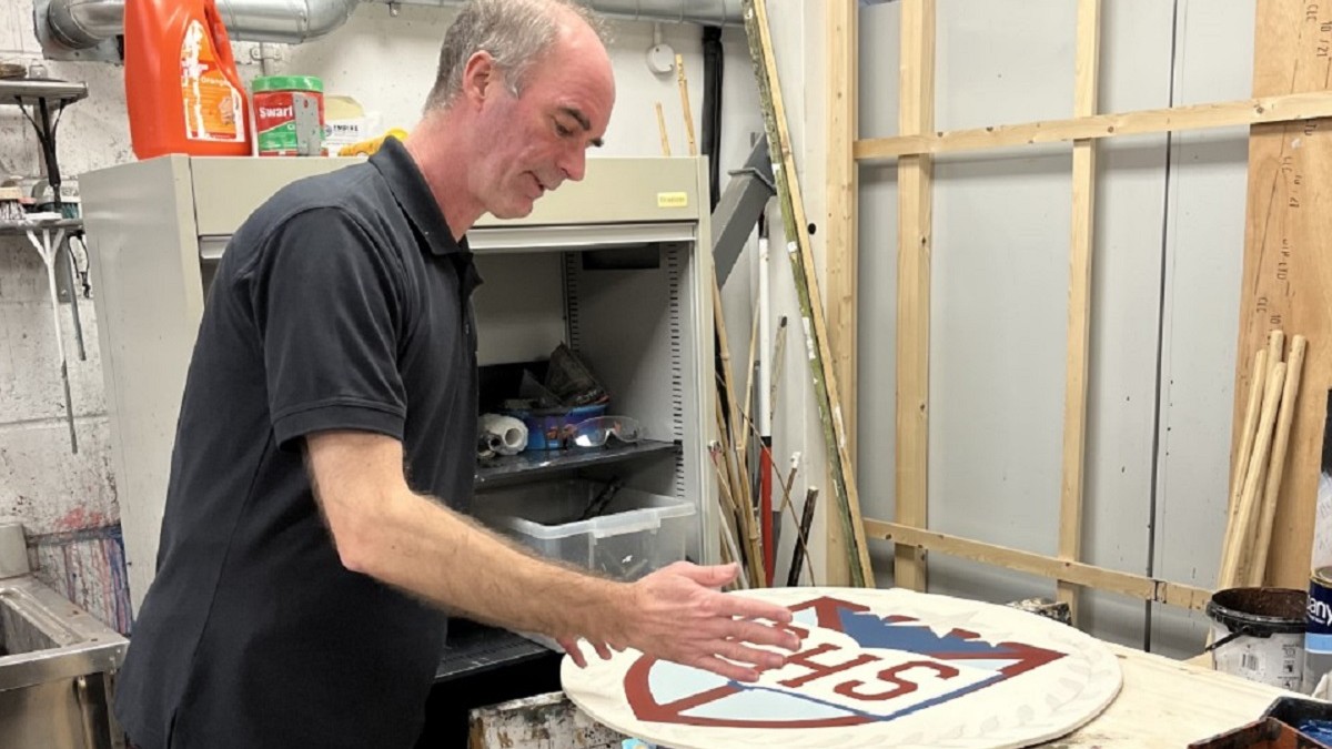 Roger Ness looking at a set design in the GSA Scenic Studios.