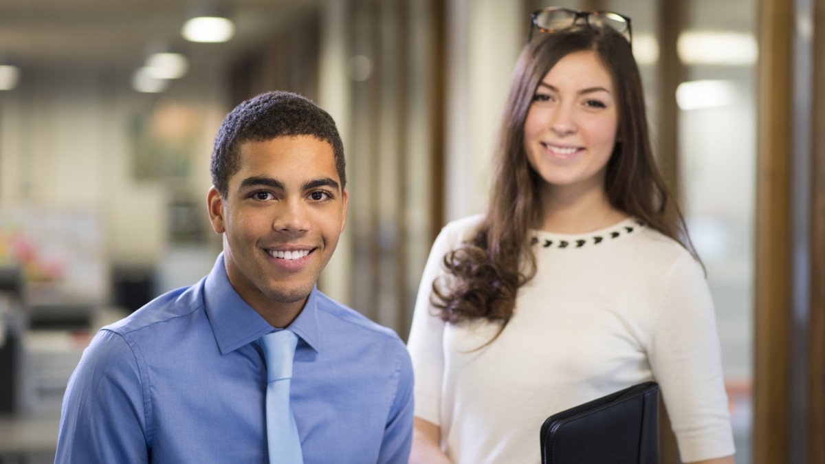 Two university students pictured in a modern office
