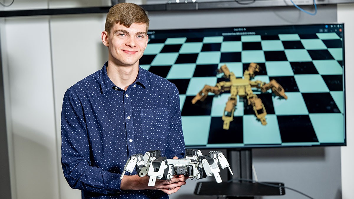 Student with spider robot