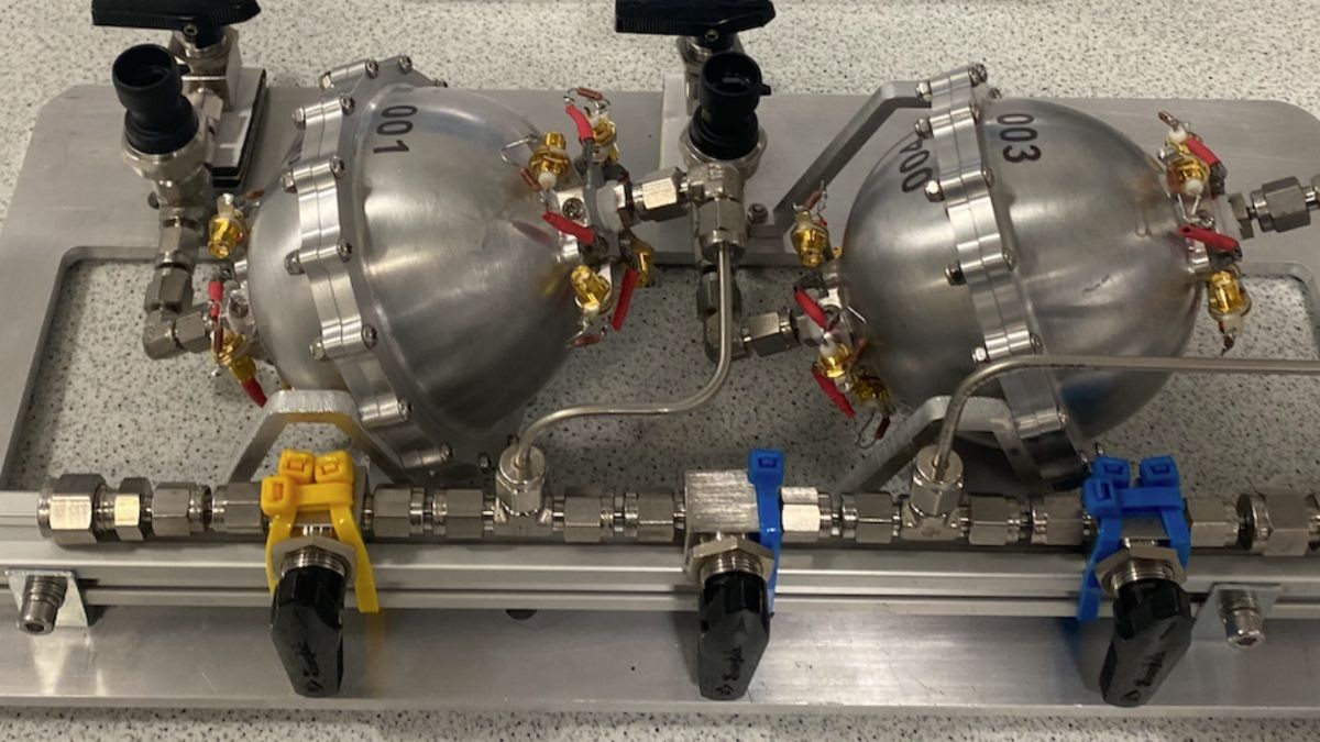 Two shiny spheres and complex connectors and monitors comprise Atout's Smart Tanks for Space