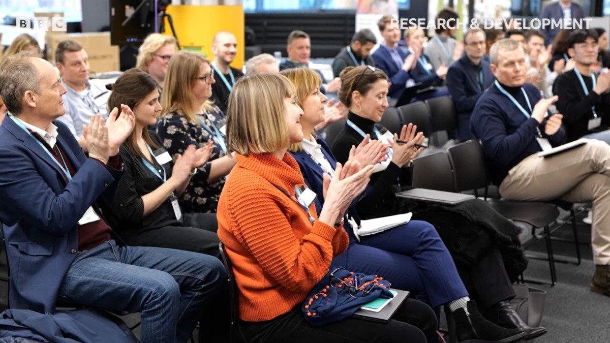 IAB meeting people clapping