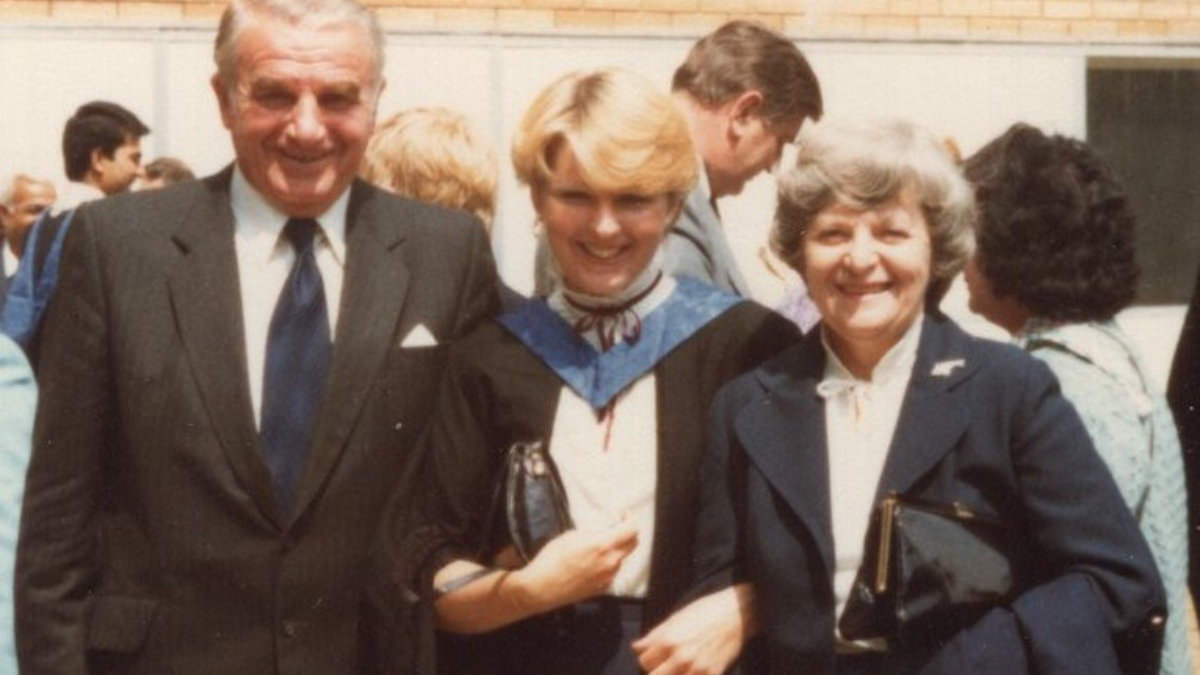 Judith on graduation day with her parents