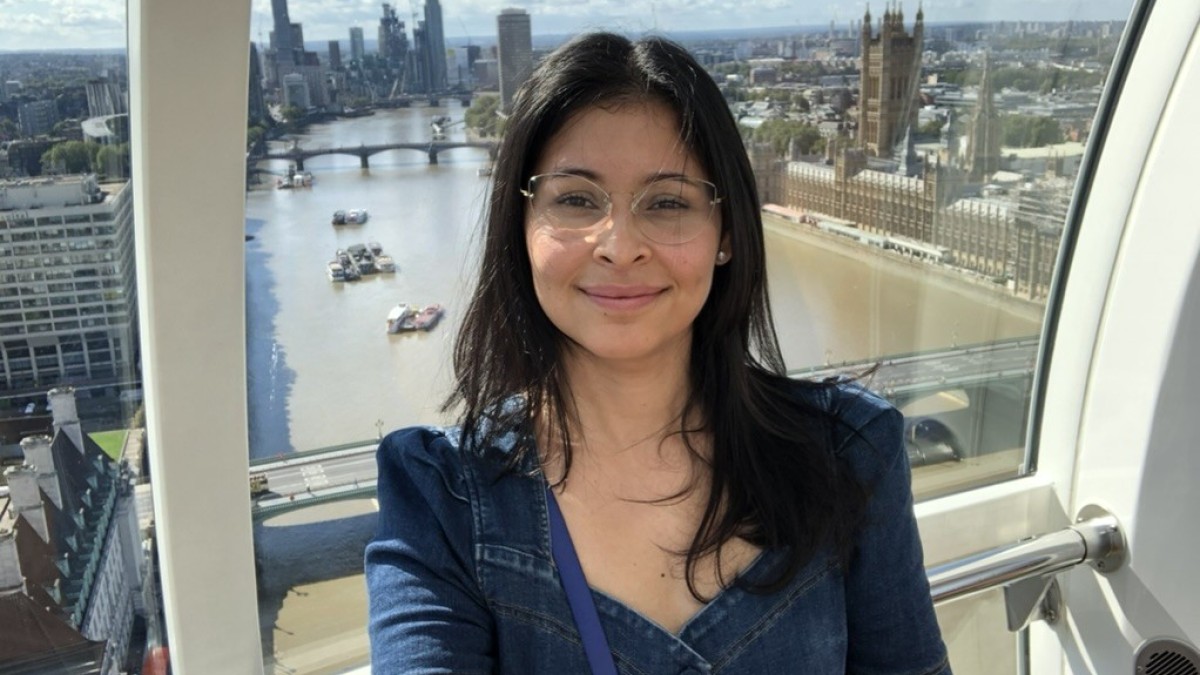 Larissa takes a selfie in the London Eye with the Thames visible behind her.
