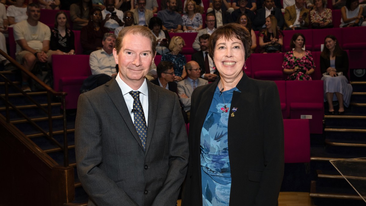 Dr Nicky Fox poses in front of the audience at the Royal Institution with the University of Surrey's President and Vice-Chancellor, Professor Stephen Jarvis