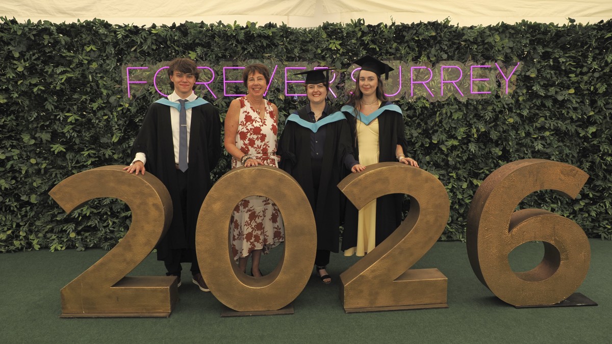 Dr Nicky Fox poses with prize winners Harry Clarke, Alice Willoughby and Maisy Willett
