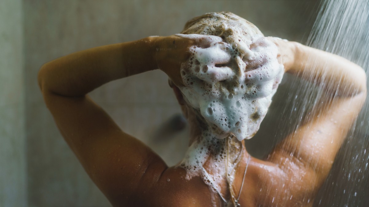 woman shampooing hair