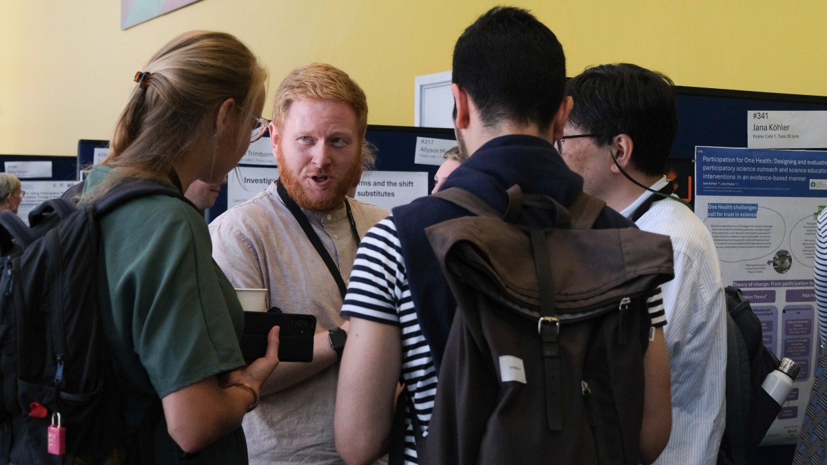 Attendees of IAPS 2026 share their research findings in an exhibition.