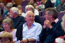 Two men talking in the audience