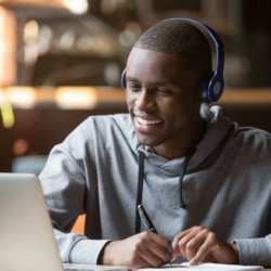 male student looking at his laptop screen