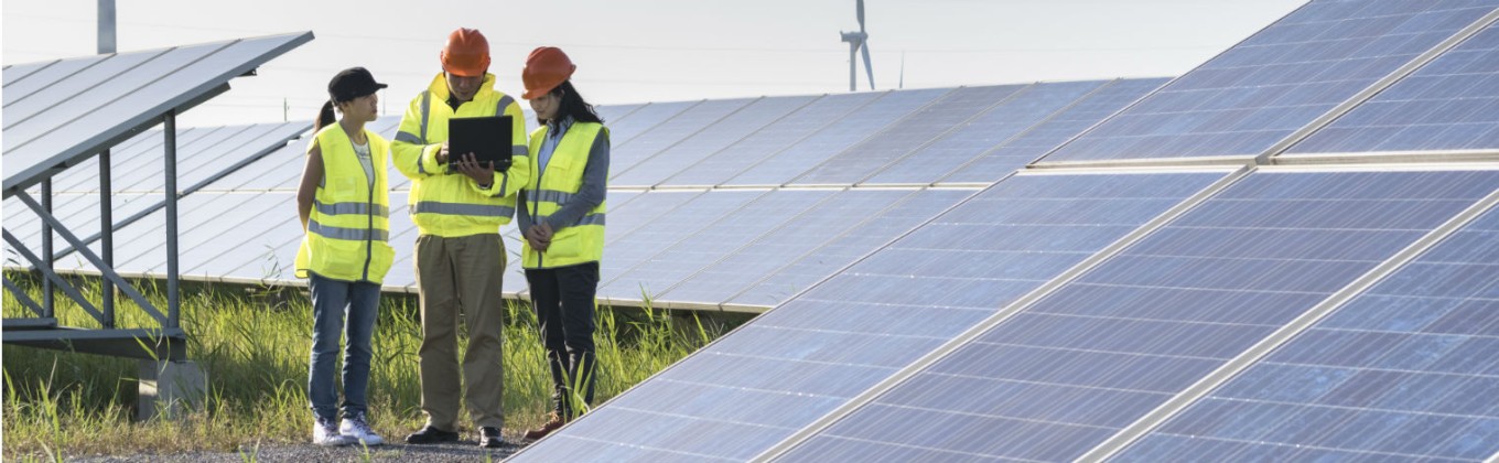 Engineers at solar panels