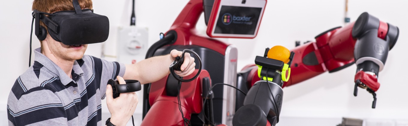 Student using virtual reality headset to control robot