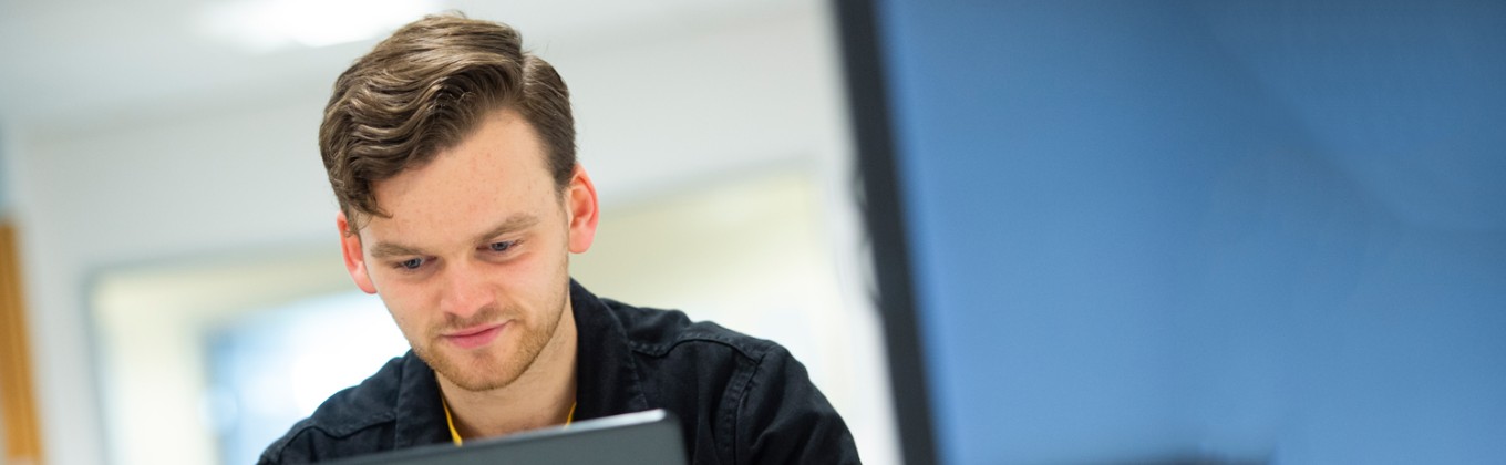 Student sat at laptop