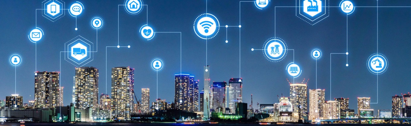 City at night with symbols in the sky